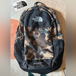 🧭 The North face camo backpack.